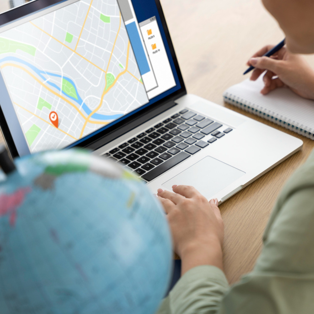 Person looking at maps on their laptop