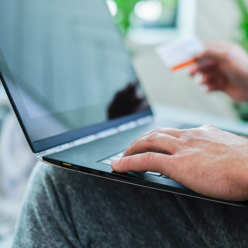 Hands typing on laptop
