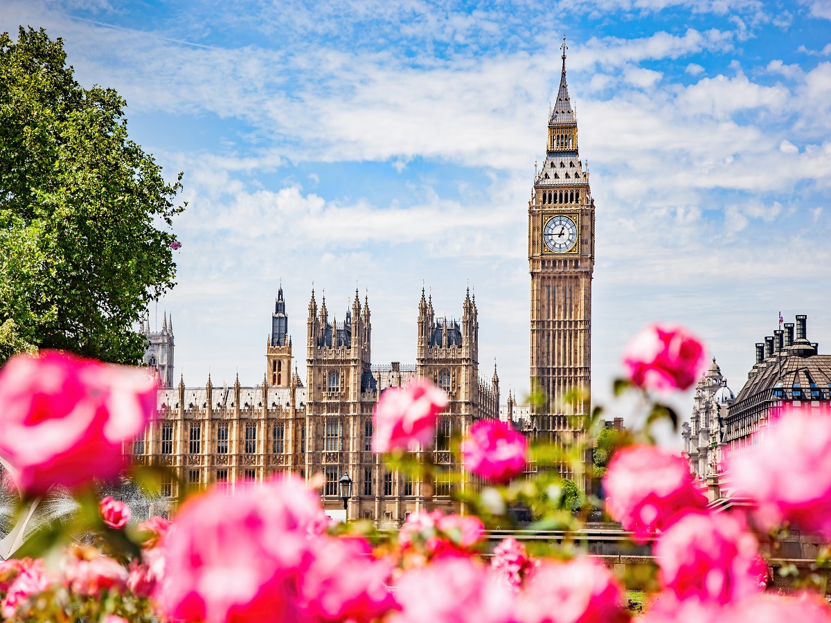 1491121312 Big Ben, the Palace of Westminster in London, UK as seen from public garden with flowers