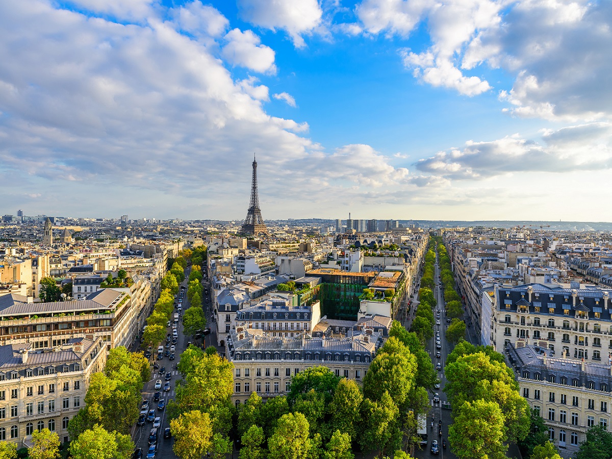 1050307170 Beautiful view of Paris from the roof of the Triumphal Arch. Champs Elysees and the Eiffel Tower at sunset