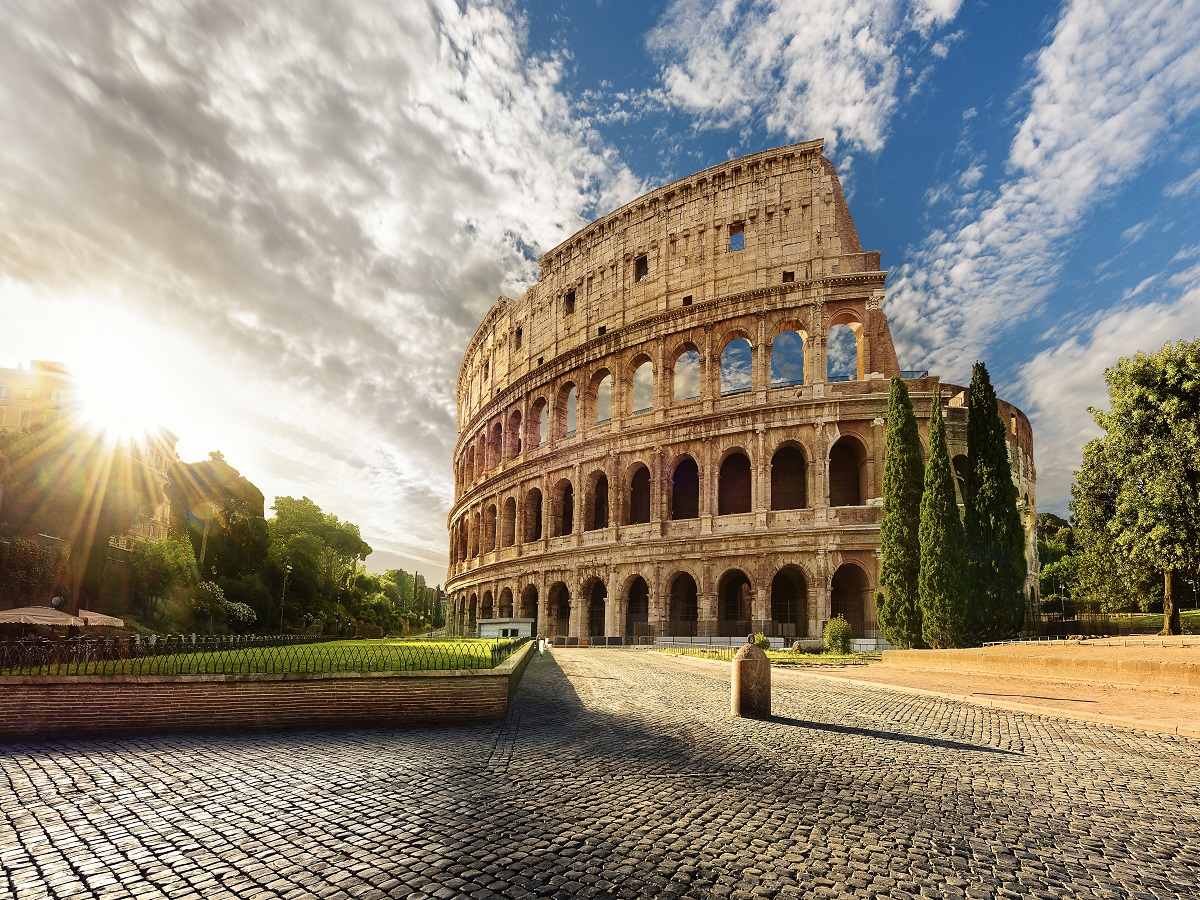 618332658 Colosseum in Rome and morning sun, Italy